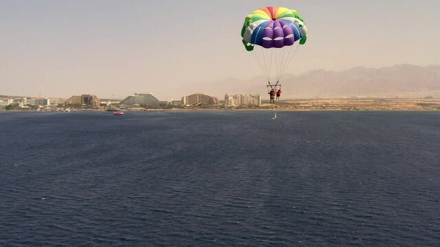 Unidentified Mother And Daughter parascending Aerial view
Drone view Close to parakiting in the red sea with Eilat Hotels, Israel
