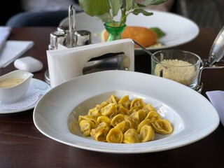 ravioli in a white plate in a cafe