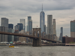 Cityscape of Manhattan with high rise buildings and the Brooklyn bridge in New York City