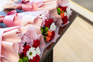 Gift bouquets with flowers are on the table