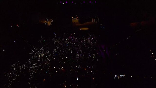 People dacing at Night Club Party Aerial view in the summer
drone view over open Dance club in Red sea Eilat Israel
