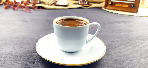 Fototapeta na wymiar Traditional Turkish coffee cup and coffee beans concept with wooden floor