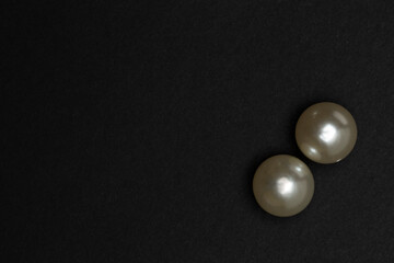 Decorative beads and copy space on black background