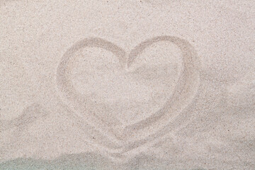 Sea coast. Inscription heart on beach sand