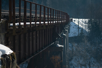 railway bridge in winter, snow on the ground