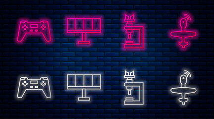 Set line Solar energy panel, Microscope, Gamepad and UAV Drone. Glowing neon icon on brick wall. Vector