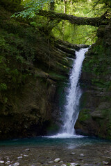 Fototapeta na wymiar waterfall in the forest, natural background