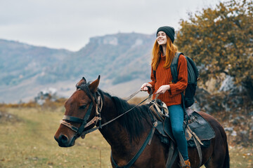 woman hiker ride horse mountains travel fresh air