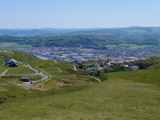 Welsh seaside town Llandudno rooftops and tram railway view from the top of Great Orme hill.