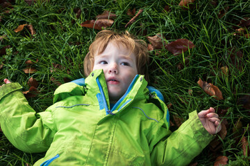 High angle view of little boy lying on the grass © nowyn