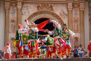 Peruvian folkloric dance, with colorful costumes in front of The Church of San Pedro Apostle of...
