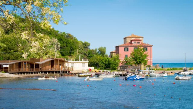 Baratti bay near the etruscan city of Populonia, known for necropoleis, old ruins, castle, sea and suggestive itineraries in Maremma park, between beaches and nature. 4K CINEMATIC CAMERA RAW FOOTAGE