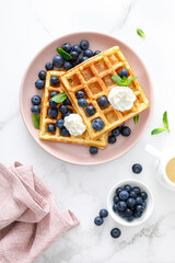 Waffles with cream cheese and fresh blueberries, healthy food, breakfast. Waffles with berries.