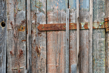 Old wooden fence gray-brown boards with cracked. Beautiful textured background for design.Old Vintage Rough Wood Bars Fence Texture Background.