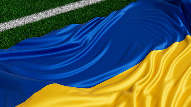 Flag of Ukraine on a Sports field. Grass Pitch with a Ukrainian Flag. Euro 2020 Soccer Wallpaper.