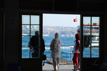 People waiting for the steamboat in wharf, Istanbul.