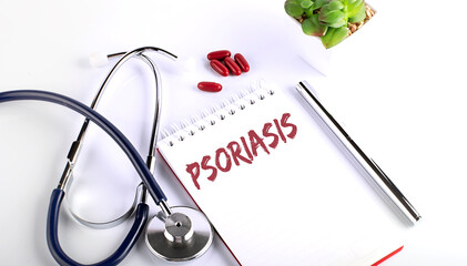 Psoriasis is a lettering of the text on the notebook . Medication treatment.