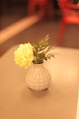 vase with yellow flowers