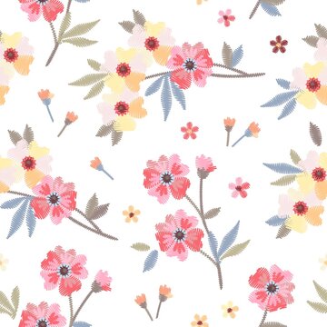 Delicate embroidery flowers on white background. Floral seamless pattern. Print for fabric and textile.