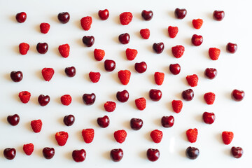 cherry and raspberry on a white background