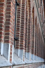 Exterior of a Brick wall building and window arches 