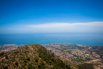 Fototapeta premium Benalmádena teleferico shot from the top of Calamorro with city and coastline in the background. Andalusia, Spain.