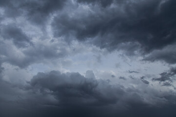 Obraz premium Epic storm sky with dark grey cumulus rainy clouds in the wind, background, texture, thunderstorm