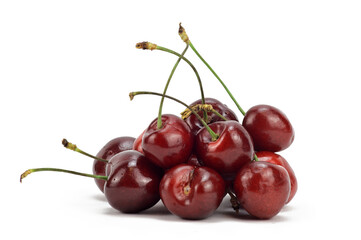Juicy ripe sweet cherry folded in a heap with cuttings sticking up
