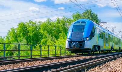 blue eco train on the tracks