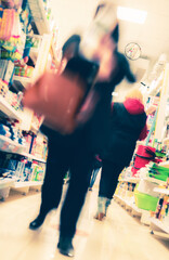 abstract defocused shoppers at supermarket