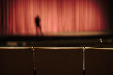 theater seats with man on stage