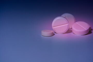 Pills on a colorful background. Medical theme.