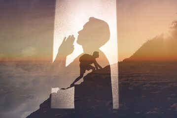 Young man praying to god for strength to get through difficult times  - obrazy, fototapety, plakaty