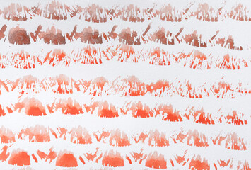 wet and dry bristle-haired brush dipped in cadmium red orange medium watercolour paint pattern on white sketchbook paper - background  