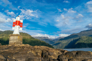 The harbor ramp leads to a lighthouse on a small island in Cochamo, Chile