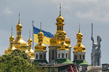 Panorama view of the Kyiv Pechersk Lavra, The Motherland Monument and Giant State Flag Of Ukraine in Kyiv, Ukraine