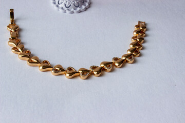 knot shape and chain shape bracelets on white box