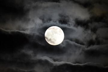 Naklejka na ściany i meble Full Moon Behind Clouds in Night Sky