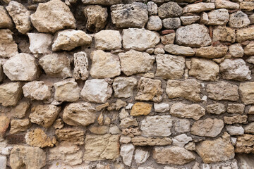 Old masonry of stones. Old stone and old masonry close-up.