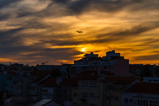 Building and plane silhouettes in colorful sunset, Alvalade - Lisbon PORTUGAL