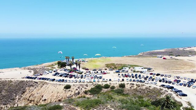 Powered parachute resort in San Diego against blue ocean water, drone view