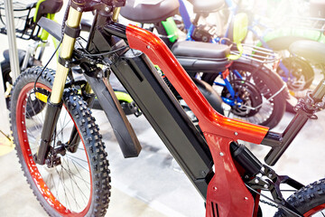 Electric bike with battery under frame in store