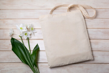 Rustic tote bag mockup with white lily