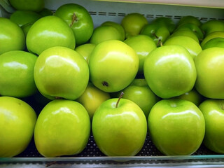 fresh green apples in the fridge