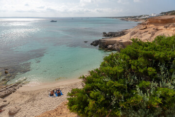 Formentera, Spain : 2021 June 04 : Young people in Formentera beach of Calo d es Mort in Balearic Islands in summer 2021