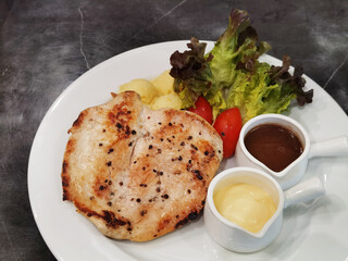 grilled chicken steak with vegetable on the plate