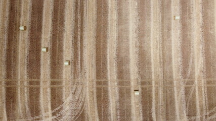 overhead aerial photo of the lines in the field after harvesting hay feed and rolling it into bales