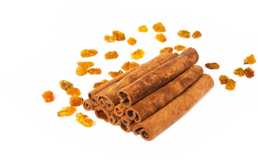 Cinnamon with raisins on a light background