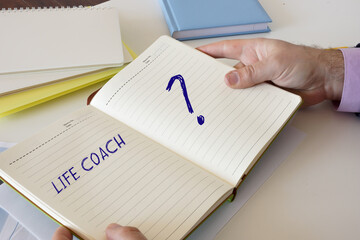 Financial concept about LIFE COACH with sign on the laptop.