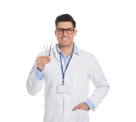 Fototapeta premium Male dentist with tools on white background